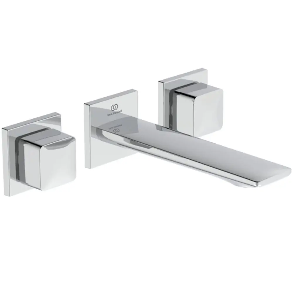 Wand-Waschtischarmatur in Chrom von Ideal Standard mit eckigen Rosetten und einem langen Auslauf. Zwei Steuerknöpfe links und rechts des Auslaufs.